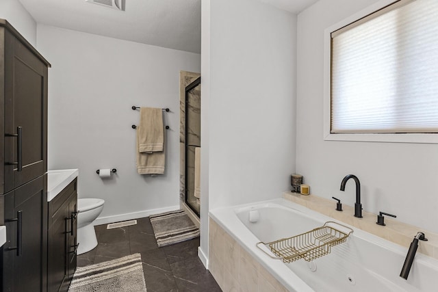 bathroom featuring a jetted tub, a stall shower, vanity, toilet, and marble finish floor