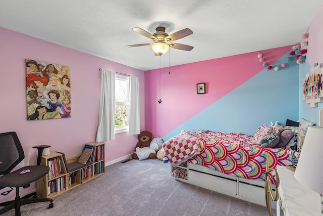 carpeted bedroom with a textured ceiling, ceiling fan, visible vents, and baseboards