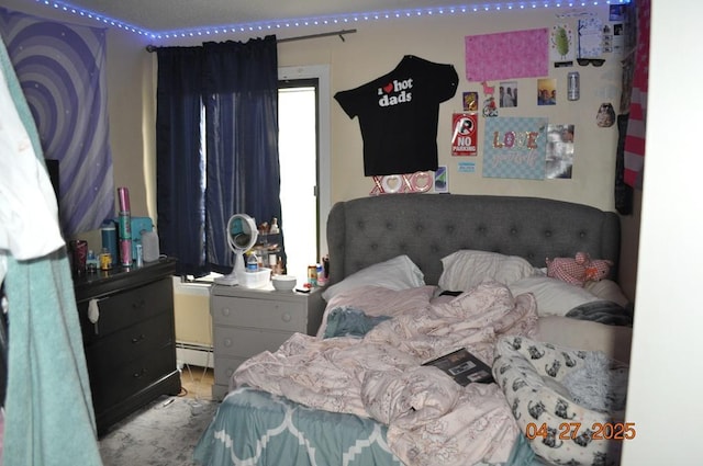 bedroom featuring baseboard heating
