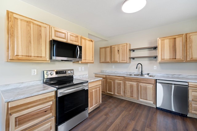 313 3rd St, Bovey, MN 55709 - kitchen with appliances with stainless steel finishes, light brown cabinets, a sink, and light countertops