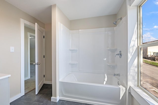 313 3rd St, Bovey, MN 55709 - full bathroom with baseboards and shower / bathtub combination