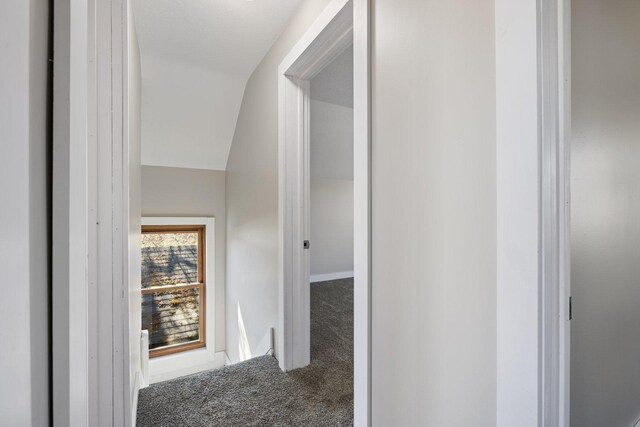 313 3rd St, Bovey, MN 55709 - hall featuring carpet, vaulted ceiling, and baseboards
