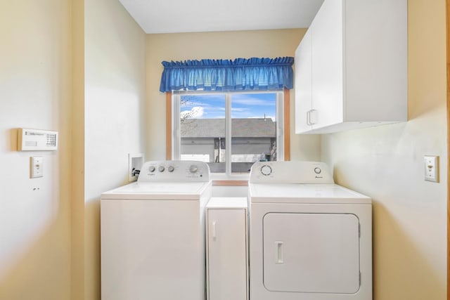 laundry room featuring cabinet space and washing machine and clothes dryer