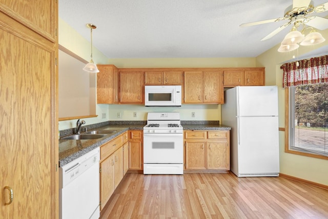 kitchen featuring ceiling fan, pendant lighting, a sink, light wood-style floors, and white appliances