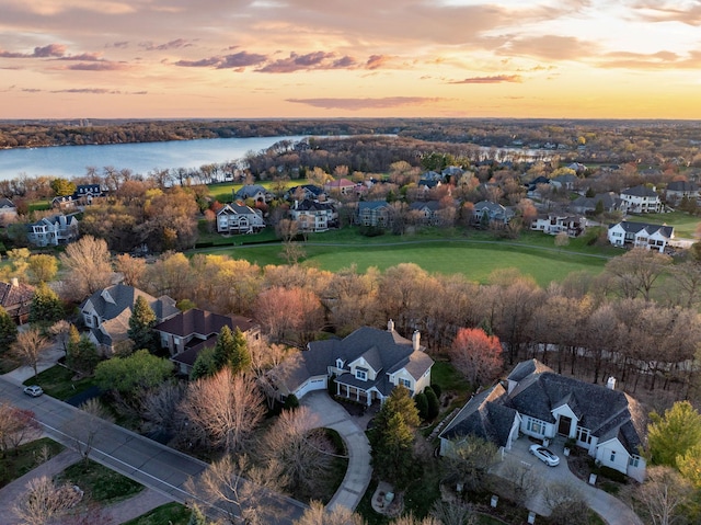 aerial view featuring a residential view and a water view