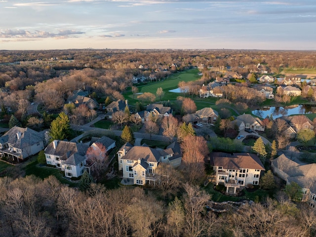drone / aerial view featuring a water view and a residential view
