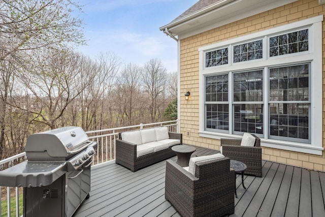 deck featuring an outdoor living space and area for grilling