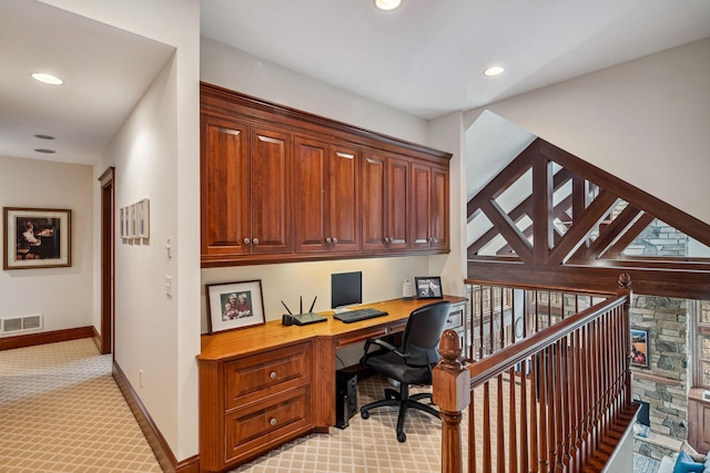 office space featuring visible vents, built in study area, baseboards, light carpet, and recessed lighting