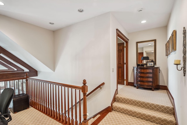 stairway featuring recessed lighting, baseboards, and carpet