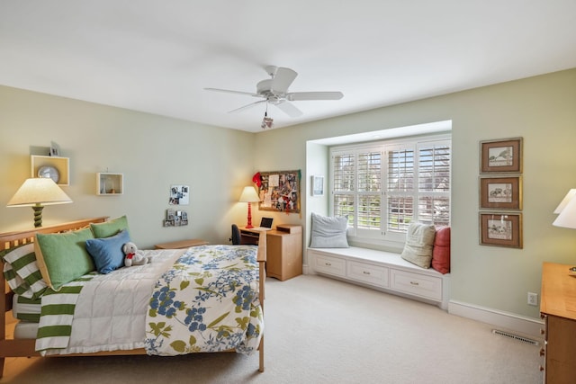bedroom with light colored carpet, a ceiling fan, and visible vents