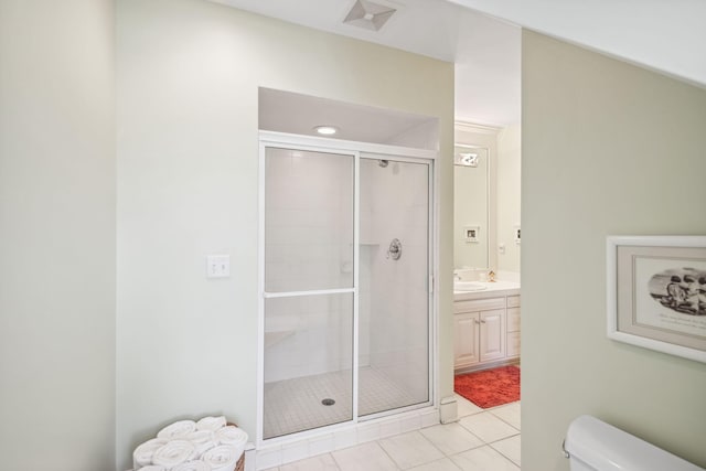 full bathroom featuring toilet, tile patterned floors, a shower stall, and vanity