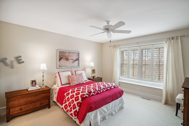 bedroom featuring visible vents, carpet flooring, baseboards, and ceiling fan