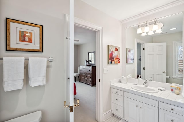 bathroom featuring vanity and toilet