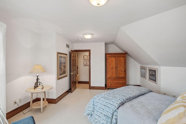 bedroom with baseboards, lofted ceiling, visible vents, and light carpet
