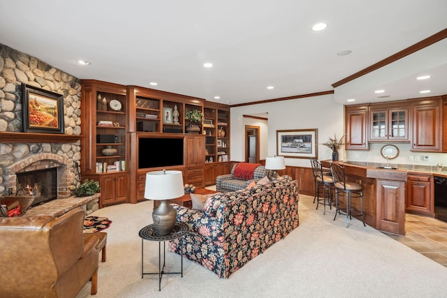 living area featuring recessed lighting, crown molding, and light carpet