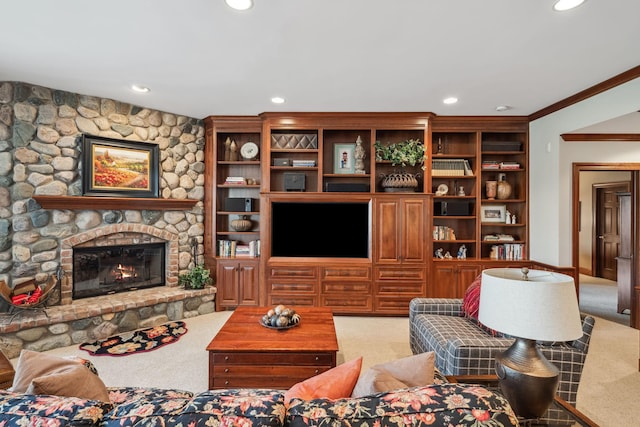 carpeted living room with recessed lighting, ornamental molding, and a stone fireplace
