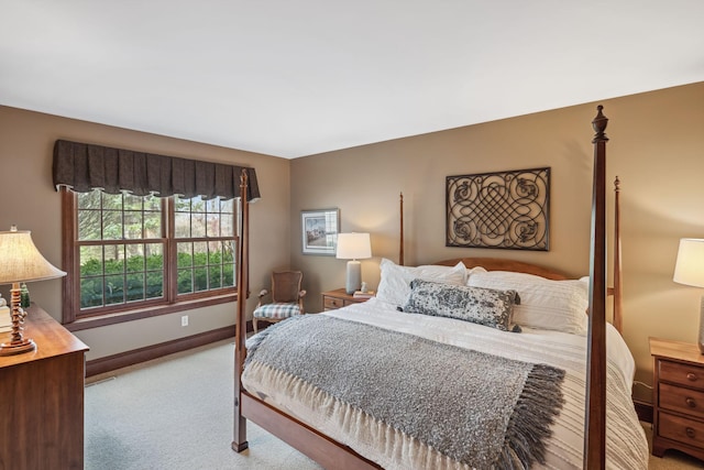 bedroom with carpet floors and baseboards