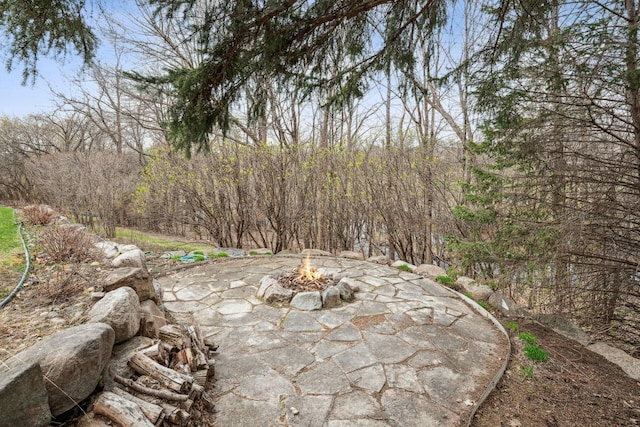 view of patio featuring an outdoor fire pit