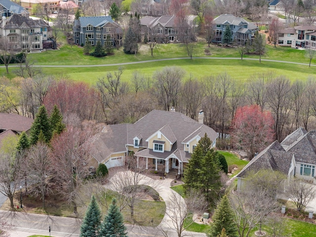 birds eye view of property with a residential view