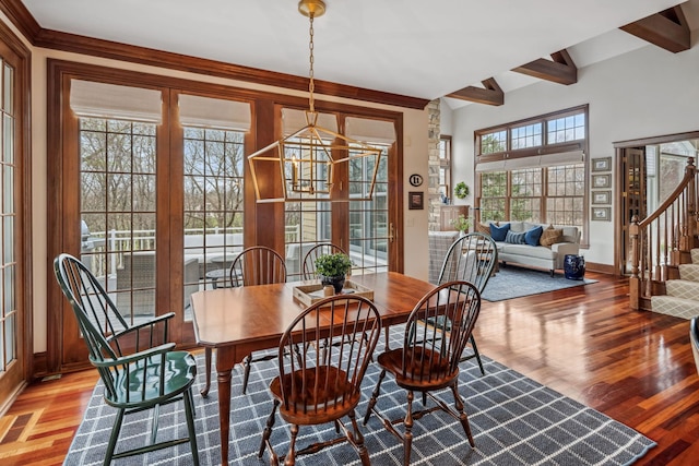 18371 Bearpath Trl, Eden Prairie, MN 55347 - dining area featuring stairway, wood finished floors, baseboards, and beamed ceiling