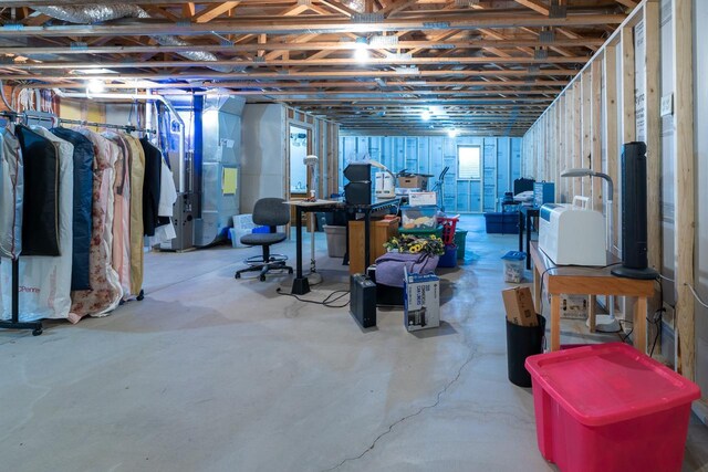 below grade area featuring heating unit