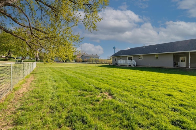 view of yard with a wooden deck