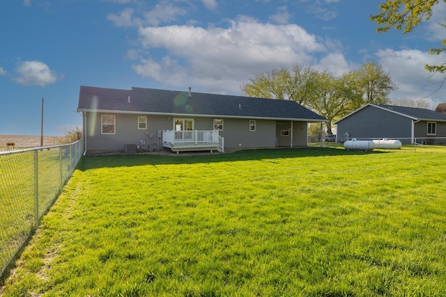 rear view of property featuring a deck and cooling unit