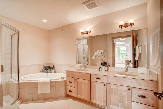 650 Main St N Unit 308, Stillwater, MN 55082 - full bath featuring a garden tub, a shower stall, double vanity, tile patterned flooring, and recessed lighting
