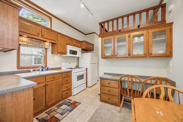 18096 Browns Lake Rd Unit 2, Eden Lake Twp, MN 56368 - kitchen featuring white appliances, light tile patterned flooring, brown cabinets, glass insert cabinets, and crown molding