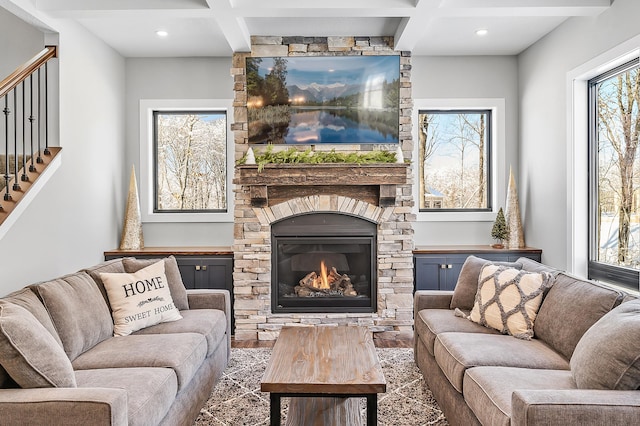 2451 180th Ln NE, Ham Lake, MN 55304 - living room featuring wood finished floors, stairs, beam ceiling, and a fireplace