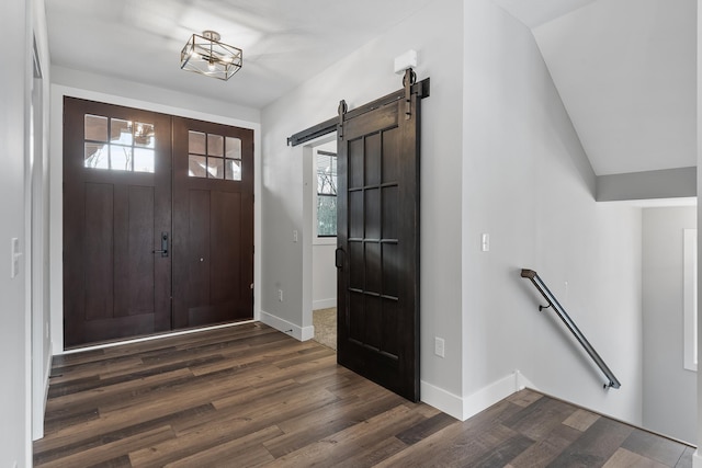 2451 180th Ln NE, Ham Lake, MN 55304 - entrance foyer featuring baseboards, dark wood-style flooring, and a barn door