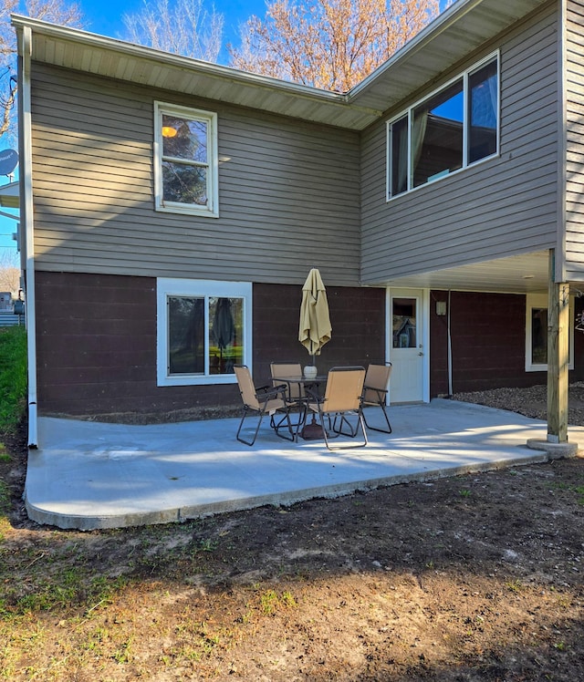 back of property featuring a patio area