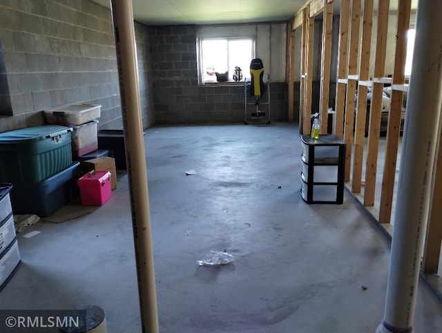 below grade area with concrete block wall