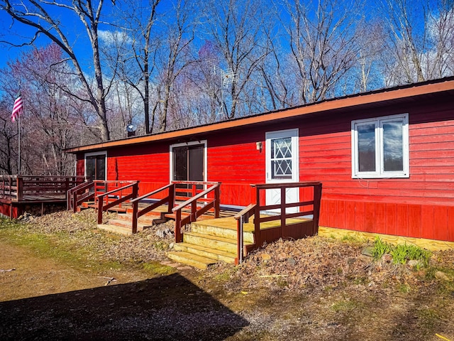 rear view of house with a deck