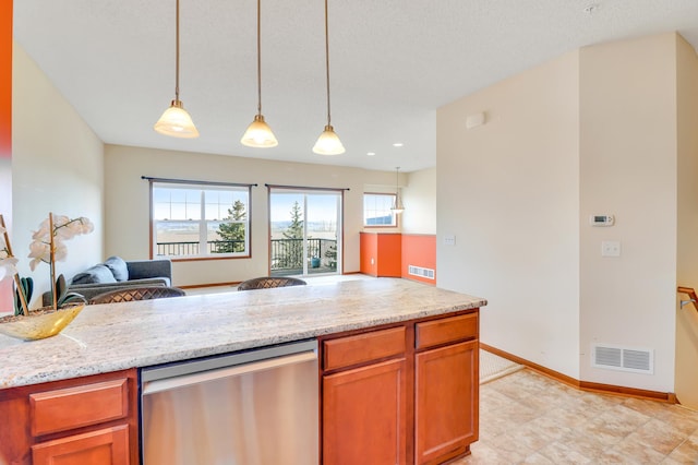 kitchen featuring visible vents, hanging light fixtures, stainless steel dishwasher, baseboards, and open floor plan