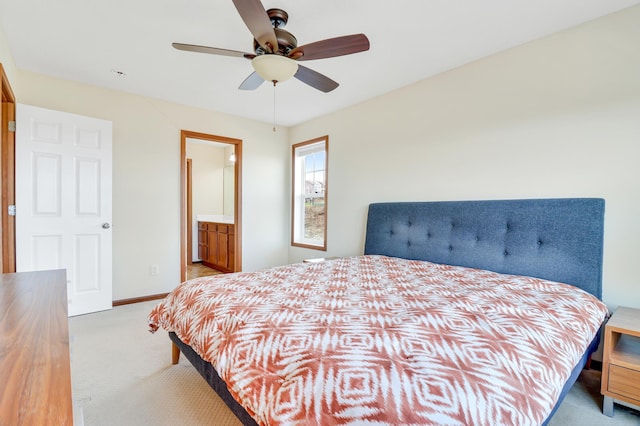 bedroom featuring baseboards, carpet flooring, connected bathroom, and a ceiling fan