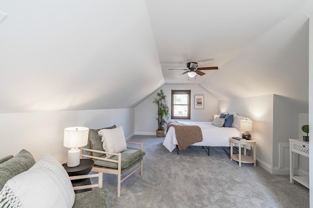 carpeted bedroom featuring baseboards, ceiling fan, and lofted ceiling