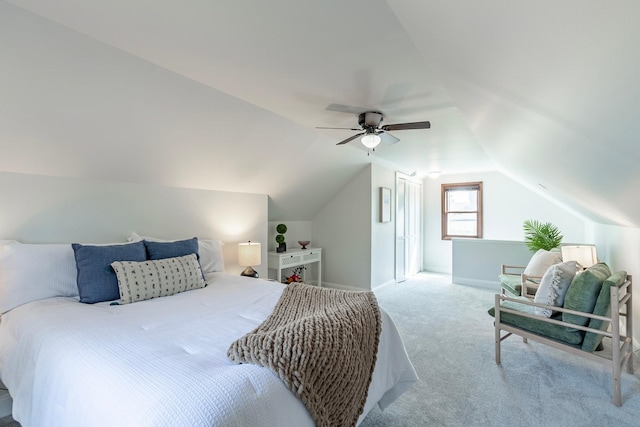 carpeted bedroom with baseboards, ceiling fan, and vaulted ceiling