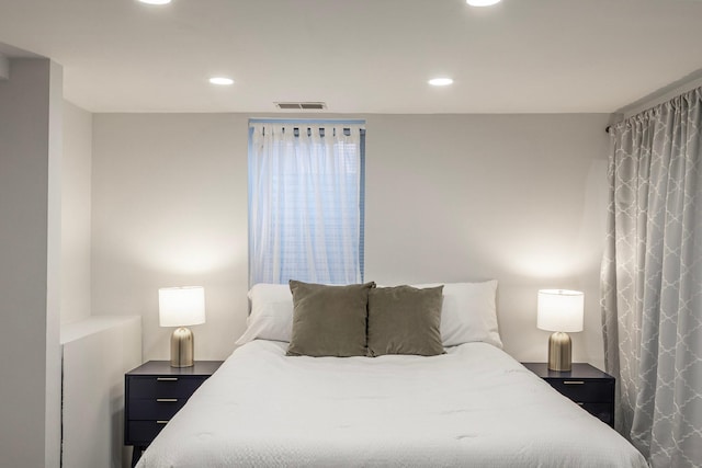 bedroom with visible vents and recessed lighting