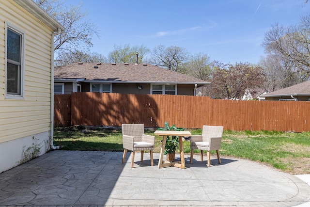 view of patio / terrace featuring fence