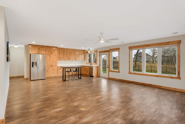 12891 Xylite St NE, Blaine, MN 55449 - unfurnished living room with a ceiling fan, wood finished floors, a sink, baseboards, and recessed lighting