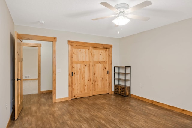 12891 Xylite St NE, Blaine, MN 55449 - unfurnished bedroom featuring a ceiling fan, baseboards, visible vents, and wood finished floors