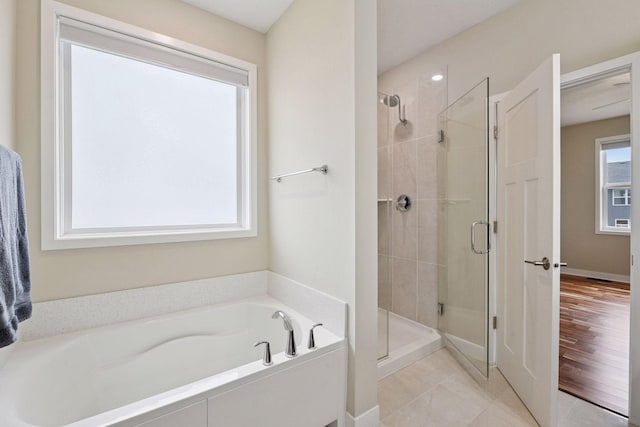 5743 Meridian Way NE, Prior Lake, MN 55372 - full bath featuring a shower stall and a garden tub