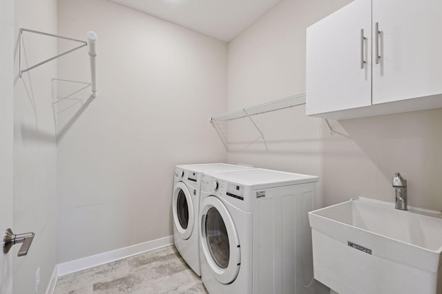 5743 Meridian Way NE, Prior Lake, MN 55372 - laundry area with baseboards, washing machine and dryer, and cabinet space