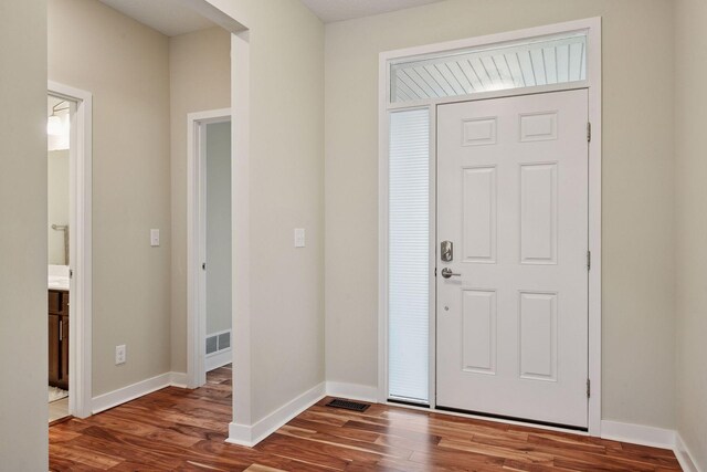 5743 Meridian Way NE, Prior Lake, MN 55372 - foyer featuring wood finished floors and baseboards
