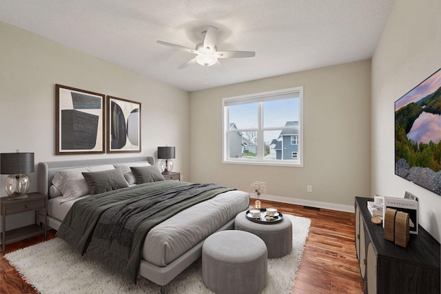 5743 Meridian Way NE, Prior Lake, MN 55372 - bedroom with wood finished floors, baseboards, and a ceiling fan