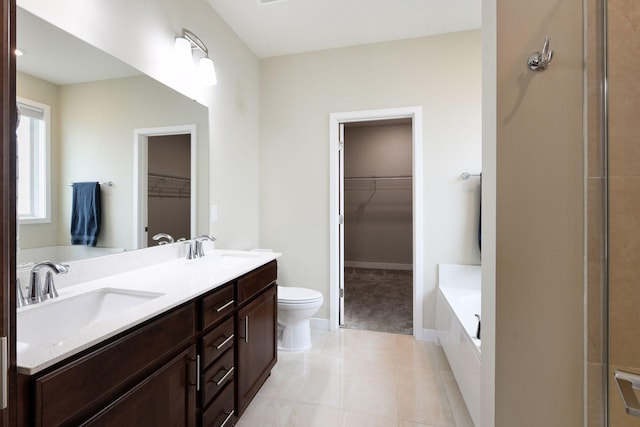 5743 Meridian Way NE, Prior Lake, MN 55372 - bathroom with a bath, toilet, double vanity, tile patterned floors, and baseboards