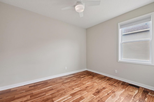 5743 Meridian Way NE, Prior Lake, MN 55372 - unfurnished room featuring light wood-style floors, baseboards, and ceiling fan