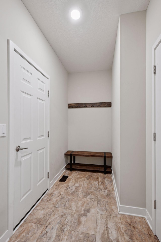 5743 Meridian Way NE, Prior Lake, MN 55372 - doorway with baseboards and a textured ceiling