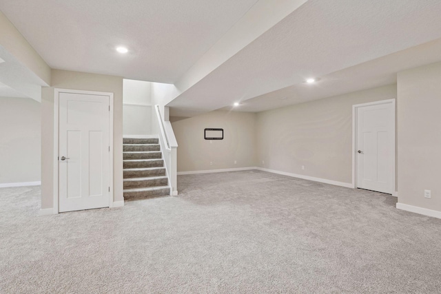 5743 Meridian Way NE, Prior Lake, MN 55372 - finished below grade area with carpet, stairs, baseboards, and recessed lighting